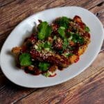 Sesame crusted pheasant goujons, hot honey sauce and coriander